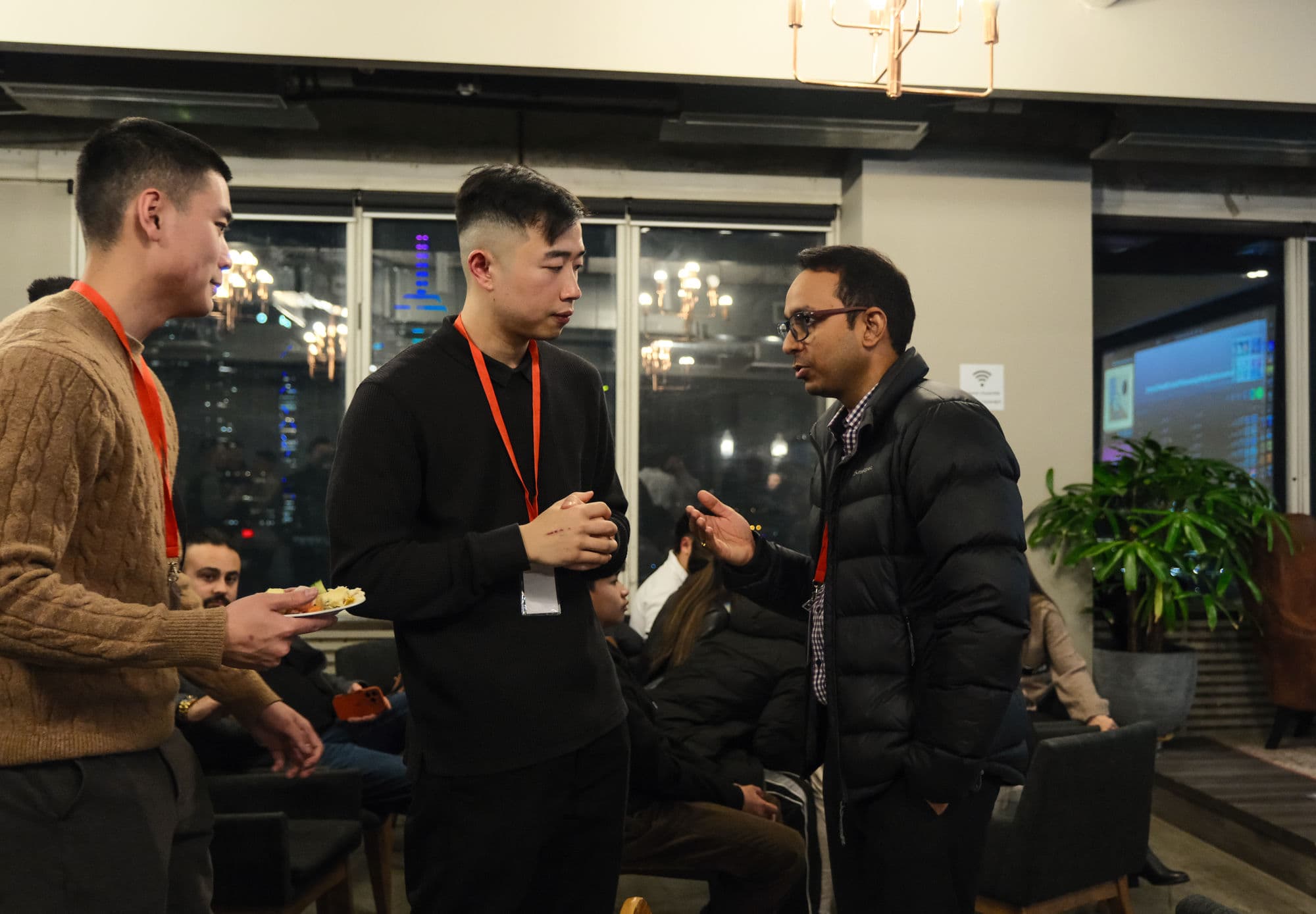 Three BNB Success members talking between sessions at a previous event